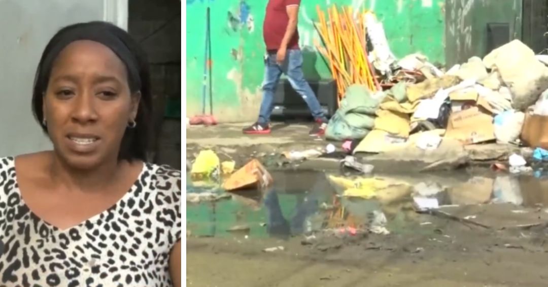 Aguas negras y basura invaden calle Moca en Villas Agrícolas; vecinos desesperados